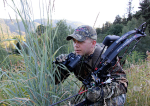 Bow hunter in the field with his compound bow