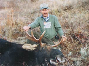 Hunter With Bull Moose