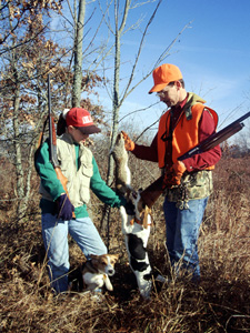 Two rabbit hunters with beagles