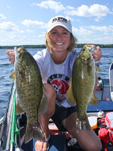 Lady angler with two smallmouth bass