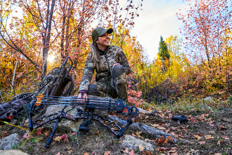 Hunter with bow and hunting gear in Utah woods