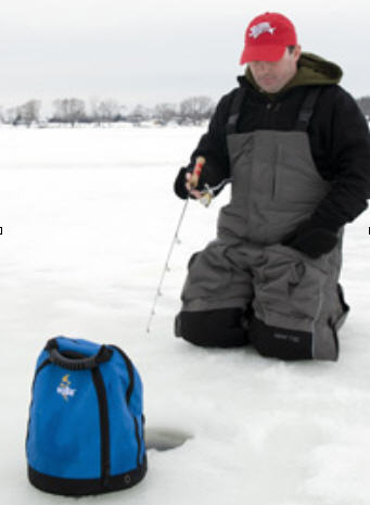 Ice angler fishing through an ice hole