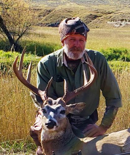 Whitetail Deer and hunter