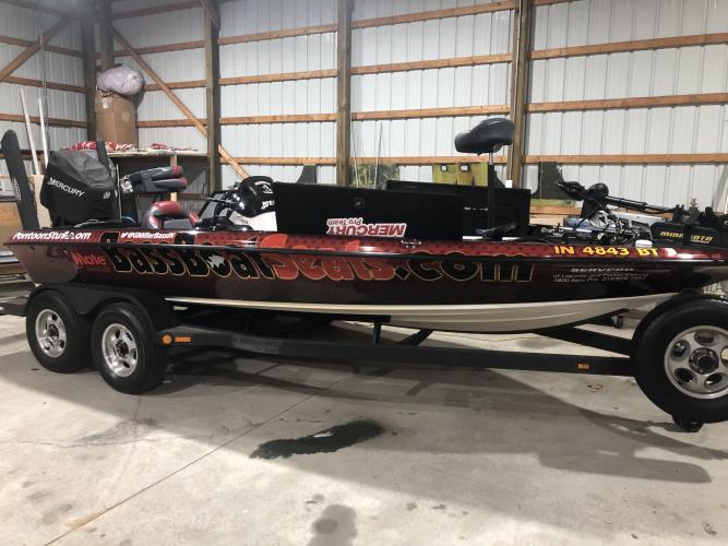 Nice bass boat with sponsor decals