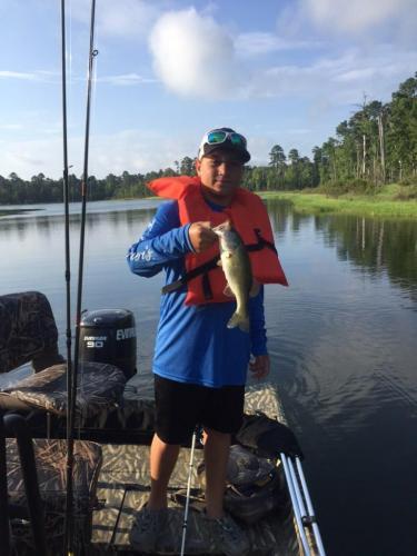 Angler with bass