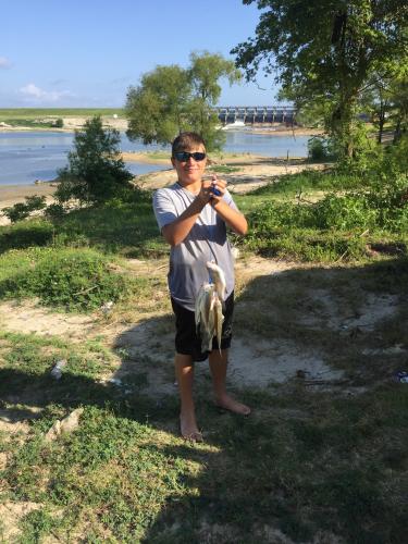 Boy with a string of bass