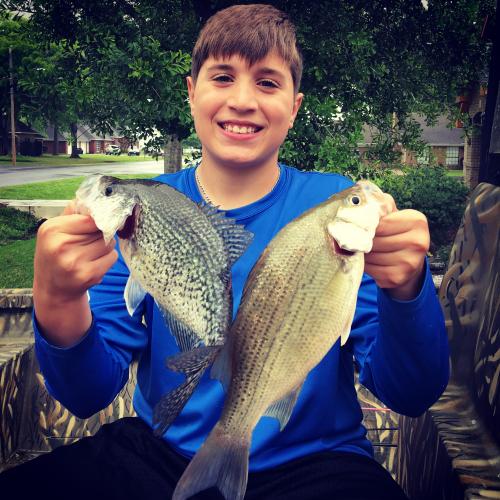 Young angler with two nice fish