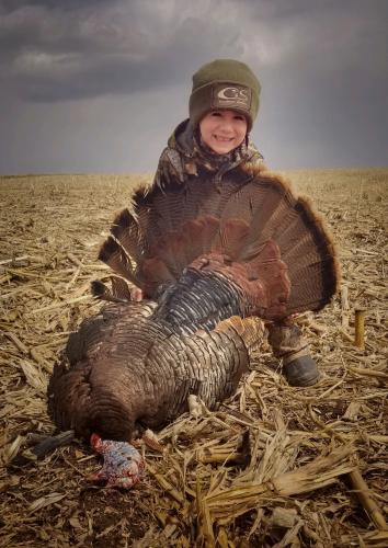 Proud Little Hunter holding up his turkey