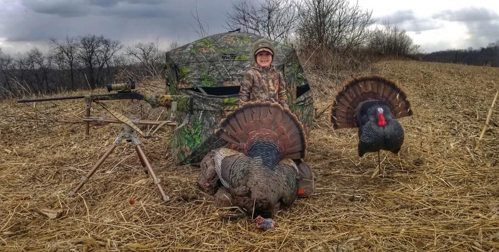 Proud young turkey hunter with his harvest