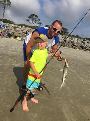 Father son with a small shark