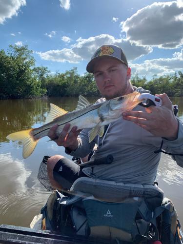 Angler holding snook