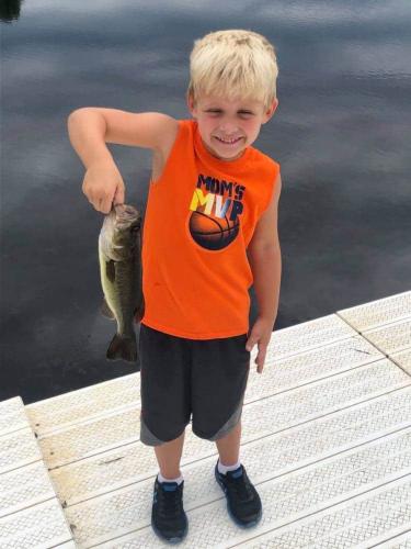 Boy holding largemouth bass