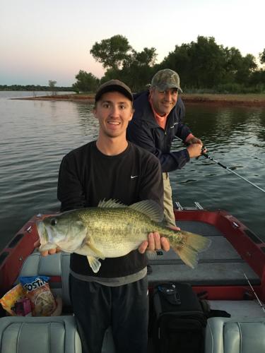 Angler holding large bass