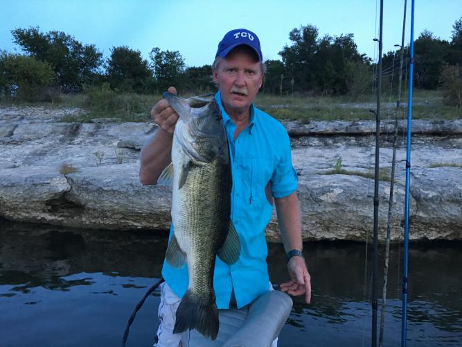 Angler holding large bass