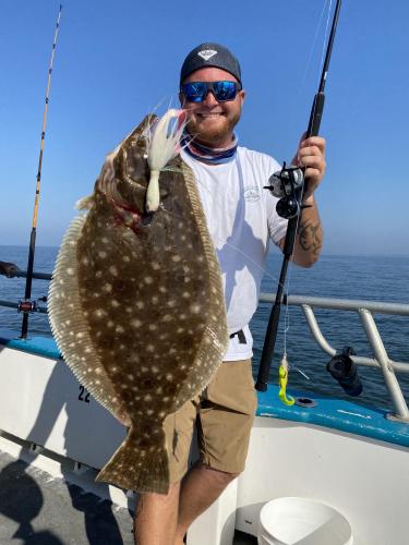 angler holding flounder
