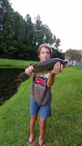 Boy with Pond Bass