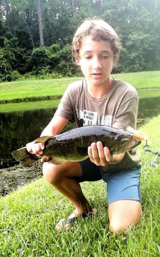 Boy holding Black Bass