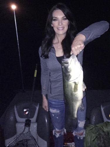 lady angler holding bass