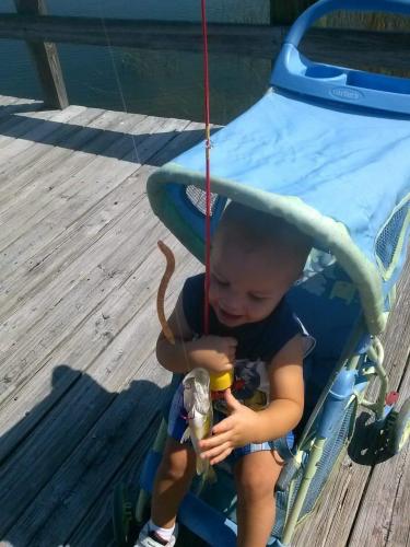 toddler reaching for bass