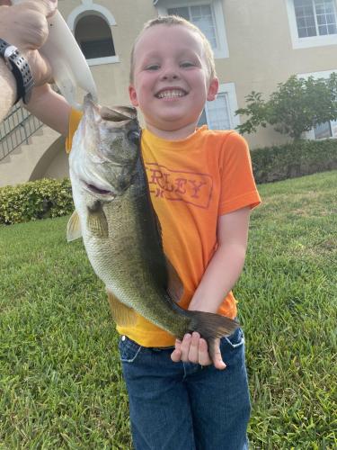 boy holding bass