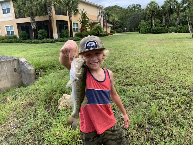 boy holding bass