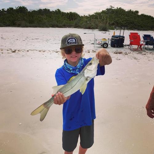 boy holding snook