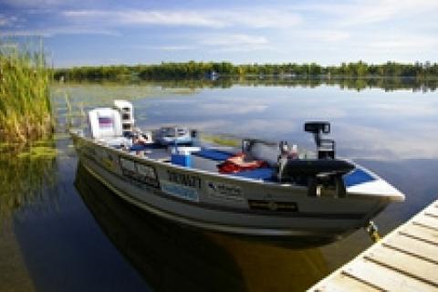 Boat in water next to boat dock