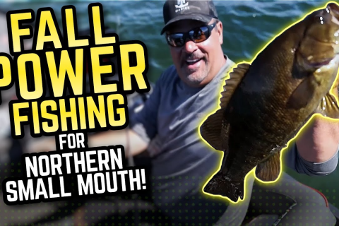 Mark Zona Holding a Small Mouth Bass
