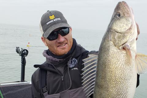 Ross Robertson holding a large walleye