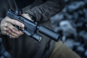 Suppressor attached to a Pistol