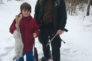 Boy & Father hunting snow shoe hare