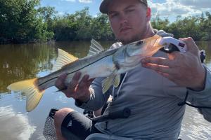 Angler holding snook