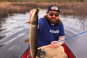 Angler with nice pike