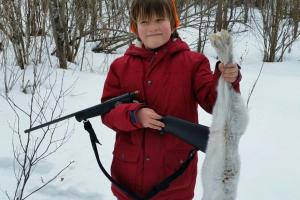 Boy holding Snow Shoe Hare