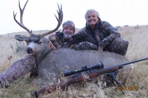 2 hunters with Mule Deer