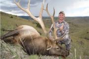 Hunter with downed elk