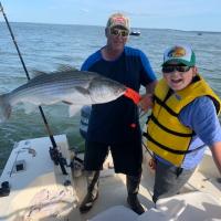 Family fishng striped bass
