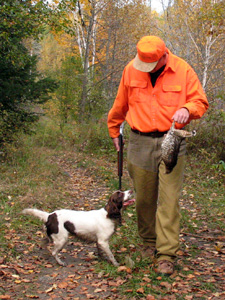 Hunting with dog and grouse