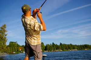 Angler fishing with a baitcast rod and reel