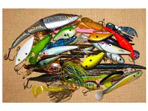 A pile of different colored fishing baits