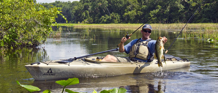 Kayak fisher catching a nice bass