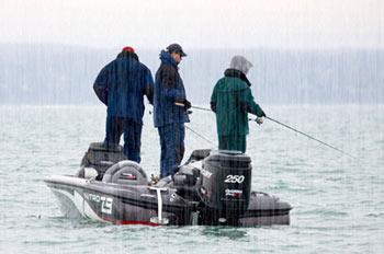 3 anglers fishing from a boat