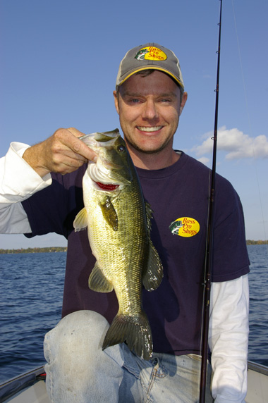 Angler holding bass