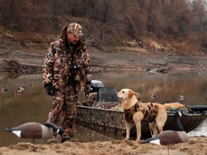 Waterfowl hunter with dog