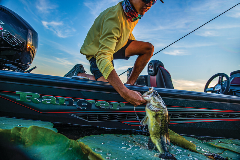 Angler holding bass on Ranger boat