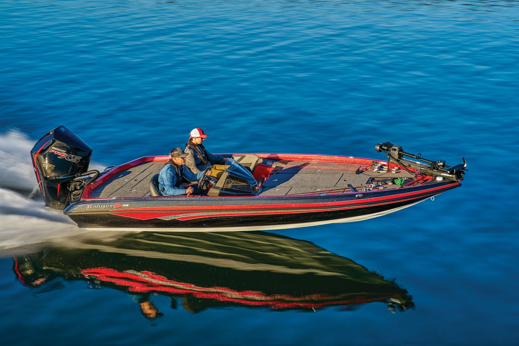 Man boating across a lake
