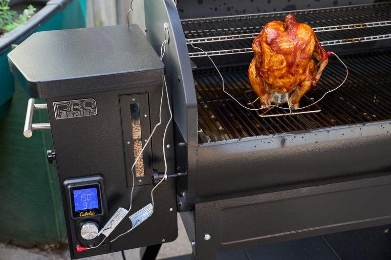 watching temperature of cabela's pellet grill with barbeque chicken
