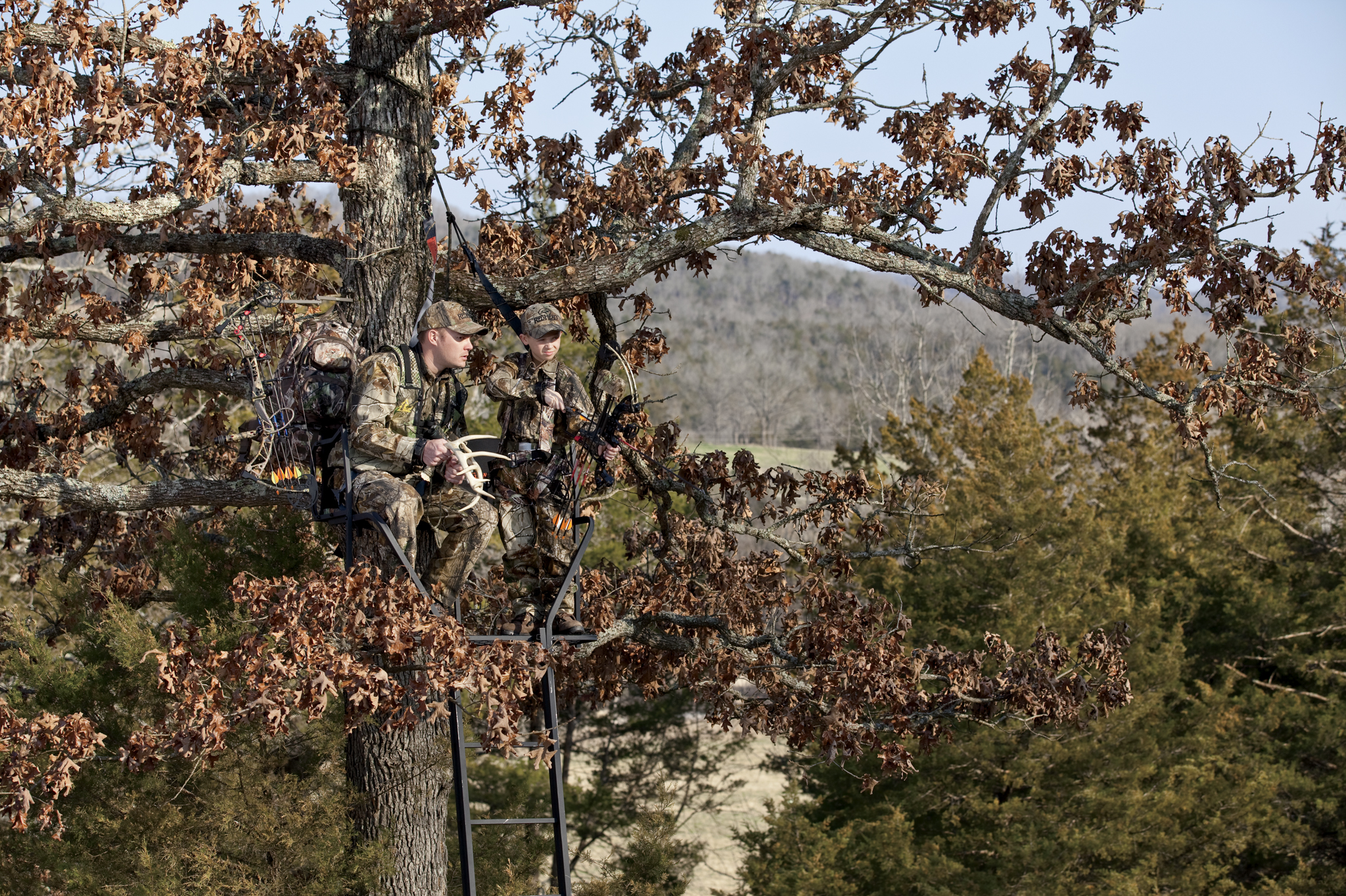 Father and son in treestand