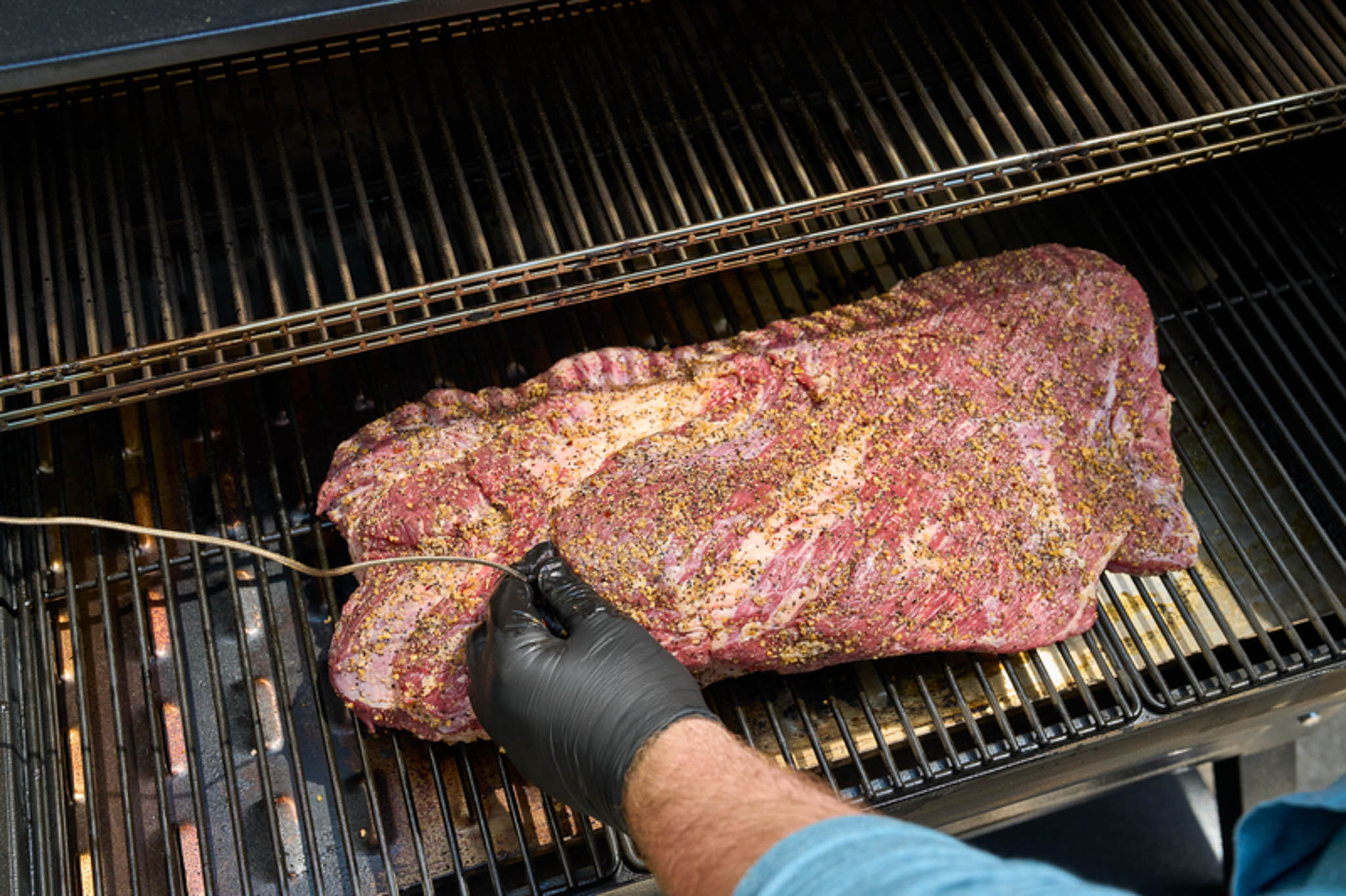 Inserting meat probe in brisket