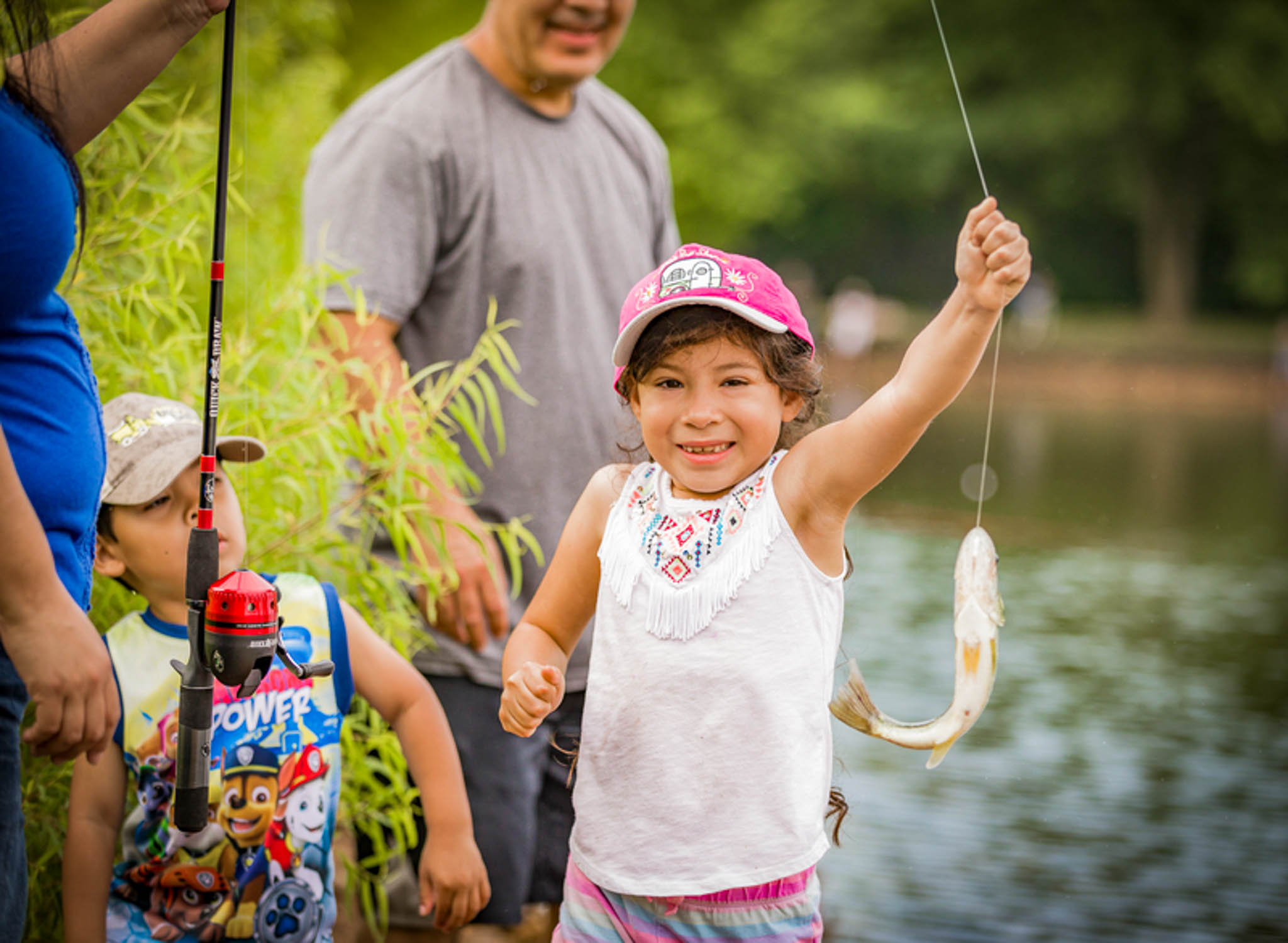 Little girl catches fish